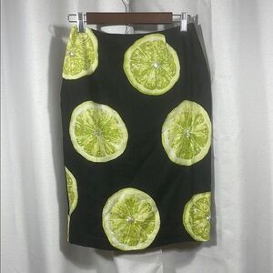 Black linen skirt with lime slices embellished with iridescent sequence midi